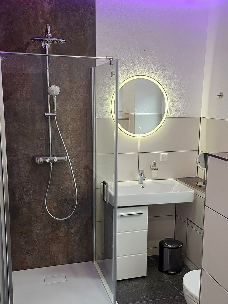 The large bathroom, coloured ceiling light
