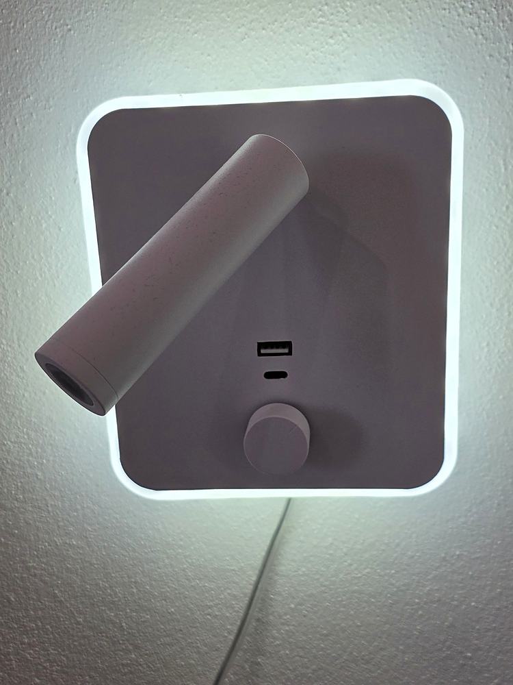 Reading light by the bed with USB-A and USB-C sockets