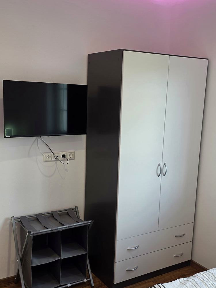 Bedroom 3, television and wardrobe